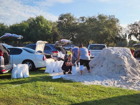 Residents fill sandbags ahead of 2022's Hurricane Ian. You can get 25 of them today at Osceola Heritage Park ahead of Idalia.