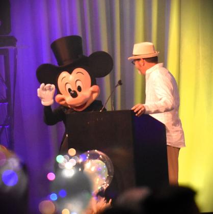 Mickie Mouse makes an appearance with Chamber CEO John Newstreet. PHOTO/KATIE WILLIAMS