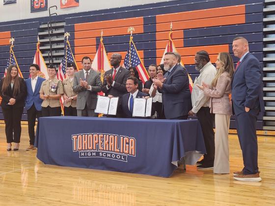 Gov. Ron DeSantis came to Kissimmee's Tohopekaliga High School Thursday to sign a pair of laws that allow for the presence of “patriotic groups” and chaplain services on school campuses. PHOTO/KEN JACKSON