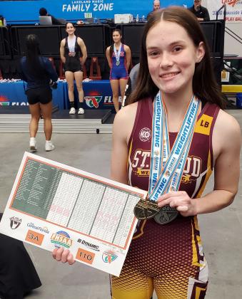 State Champion! St. Cloud’s Abigail Davis shows off her hardware after winning the 110-pound class of the FHSAA State Weightlifting Championships. PHOTO/ST. CLOUD HIGH SCHOOL
